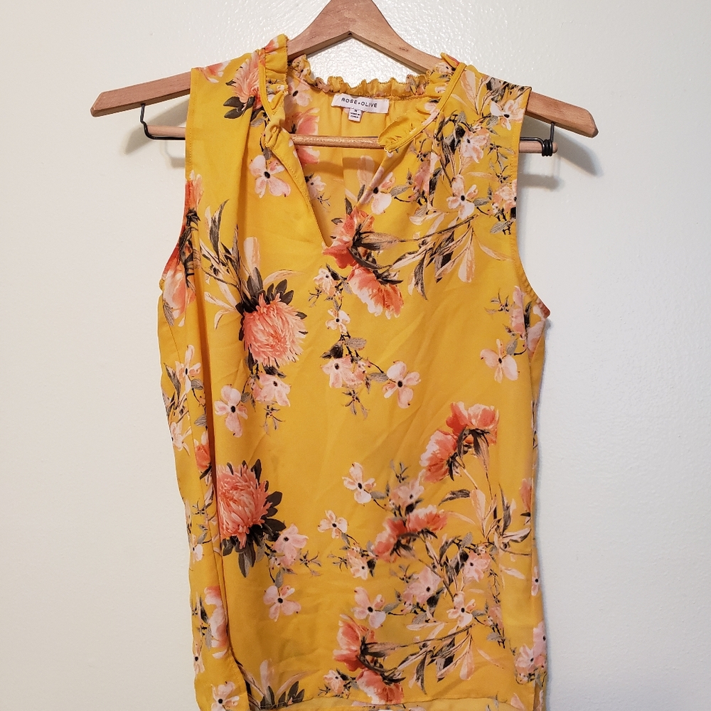 Women's yellow blouse with flowers.
